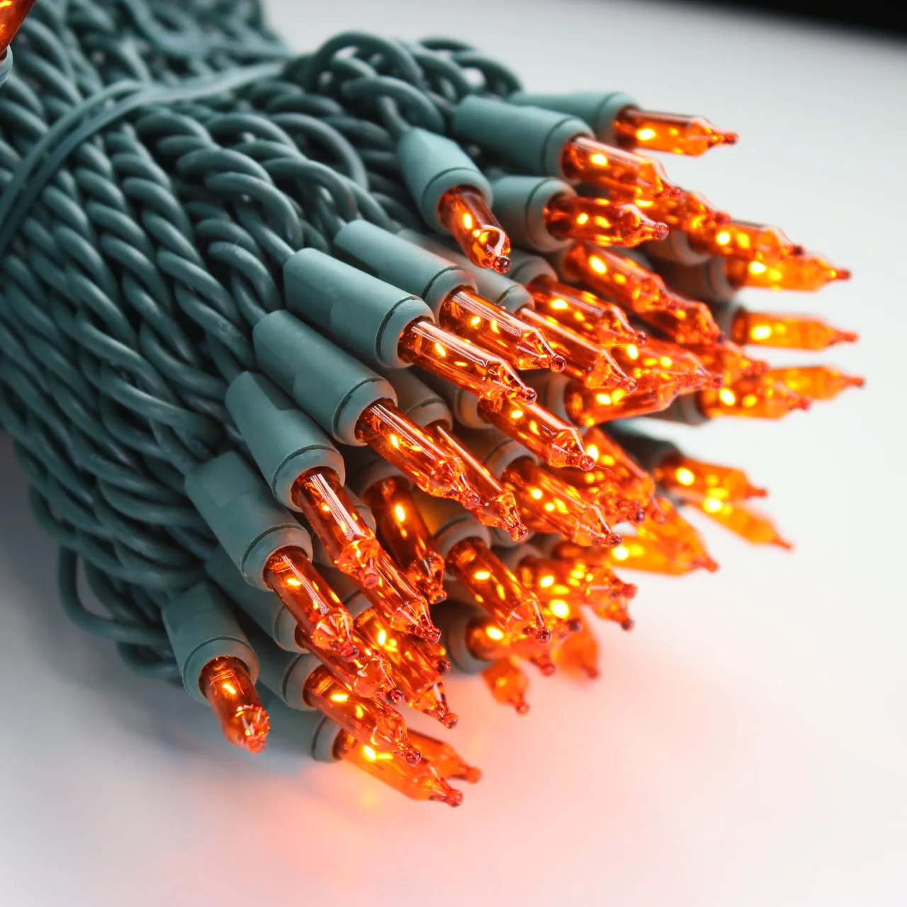 100-bulb Orange Mini Lights, 4" Spacing, Green Wire